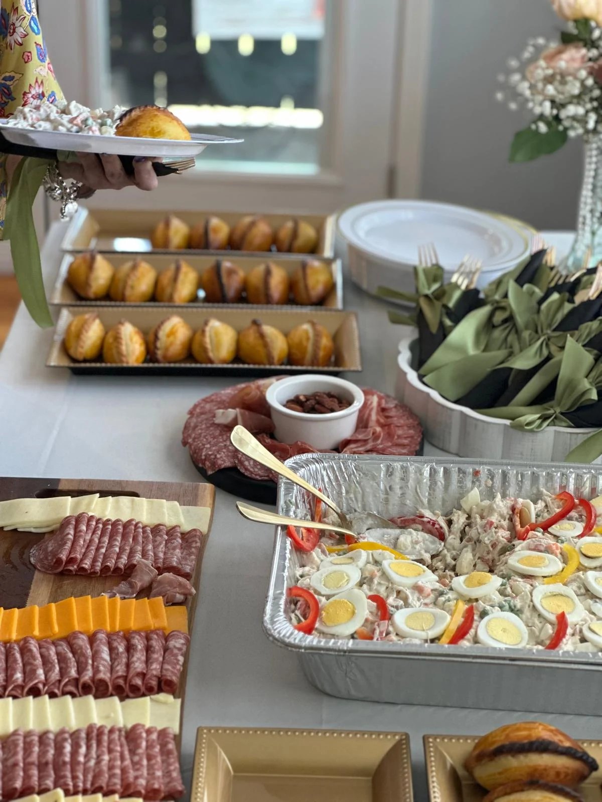 Salteñas served on trays at a family celebration