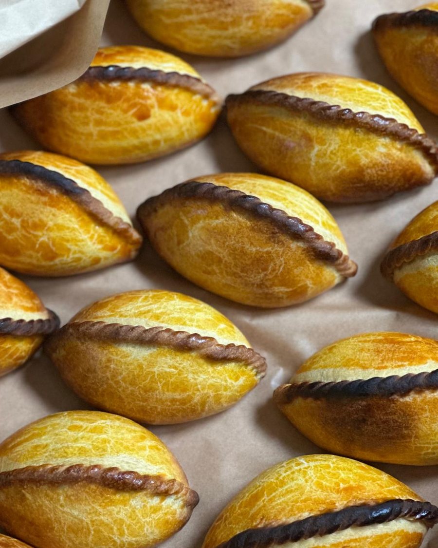 Baked salteñas, golden brown
